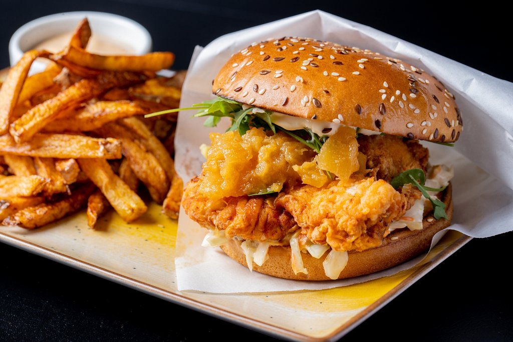 details of tasty chicken burger with fries